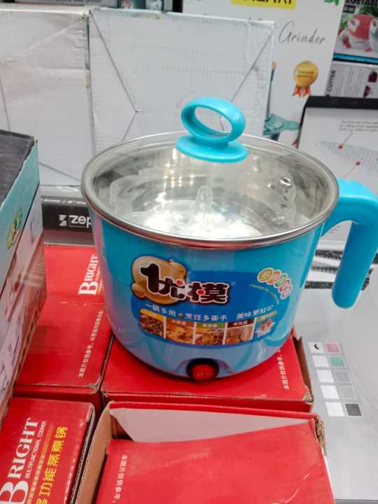 Electric pot cooker in use